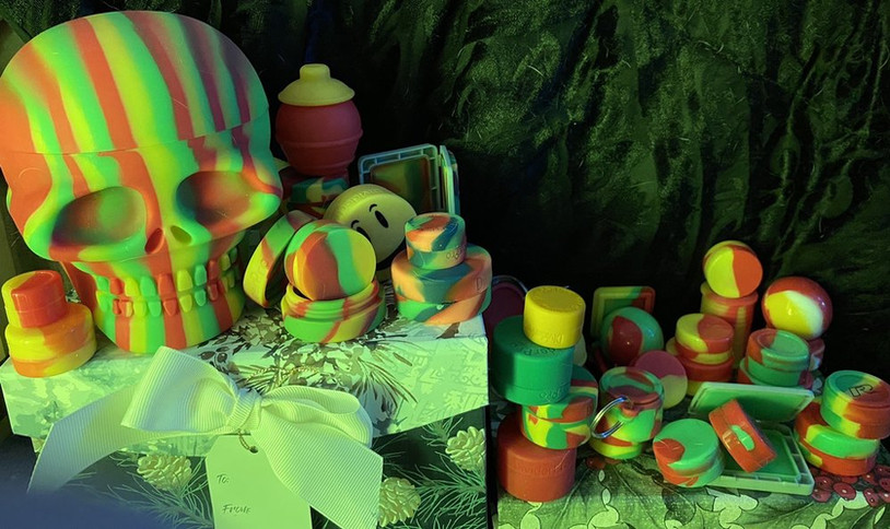 A box with a skull and various colorful toys inside, representing a mix of fun and spooky elements.