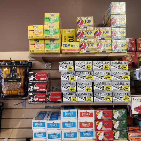A store displaying various cigarette types and other items.
