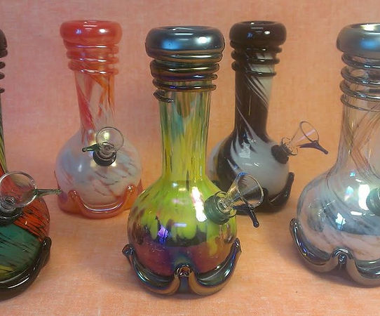 A collection of five colorful glass pipes displayed together.