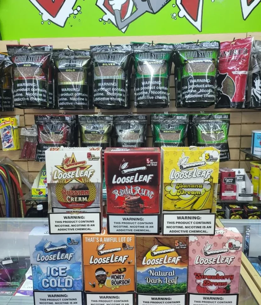 A store display showcasing a variety of cigarette brands and types.